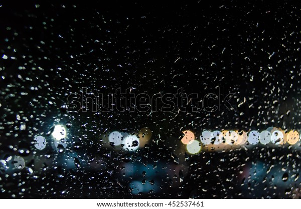 abstract blurred and rain drop\
glister bulbs lights background. Blur background. blur\
image.