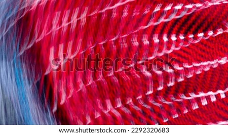 abstract blurred red, blue, white and silver background with cloth texture
