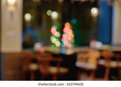 Abstract Blurred Shabu And BBQ Restaurant Interior With Empty Table Sets And Light Bokeh Background.