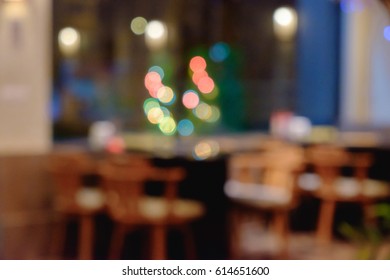 Abstract Blurred Shabu And BBQ Restaurant Interior With Empty Table Sets And Light Bokeh Background.