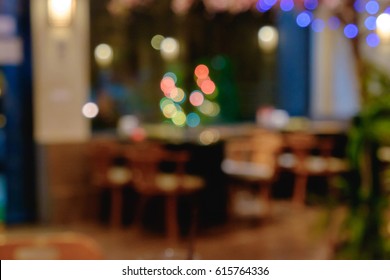 Abstract Blurred Shabu And BBQ Restaurant Interior With Empty Table Sets And Light Bokeh Background.