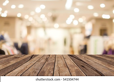 abstract blurred shopping mall corridor with wood floor panel for show,advertise product on this display