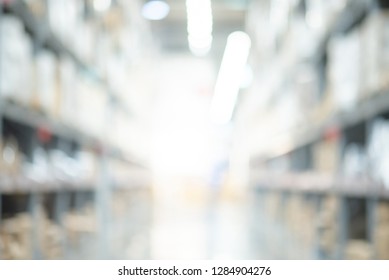 Abstract blurred shopping mall interior background. Blur corridor or aisle of supermarket, grocery store or warehouse for backdrop and design element use. Defocused background with bokeh light.