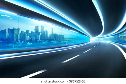 Abstract Blurred Speed Motion Road In Glass Tunnel Over The City