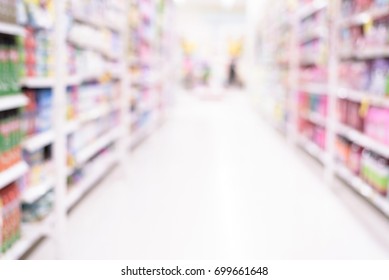 Abstract blurred supermarket aisle with colorful product shelves background. - Shutterstock ID 699661648