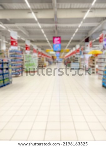 Abstract blurred supermarket aisles for background. - stock photo