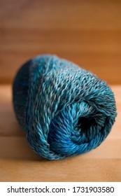 Abstract blurred swirl of coloured yarn to create a textured background.  Blue colours