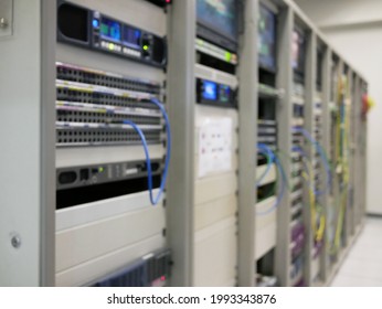 abstract blurred of switch servers in data center room.