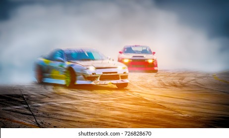 Abstract blurred two drift cars battle with smoke from burned tire