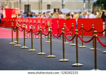 Abstract blurred Way to success on the red carpet (Barrier rope)