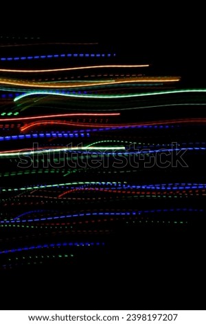 Abstract blurry background with pattern from colorful trajectory of lights