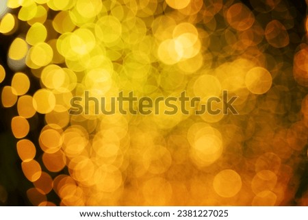 abstract blurry bokeh background of night light, Christmas party background, blurry patten in gold bright shiny, defocused disco illuminated design
