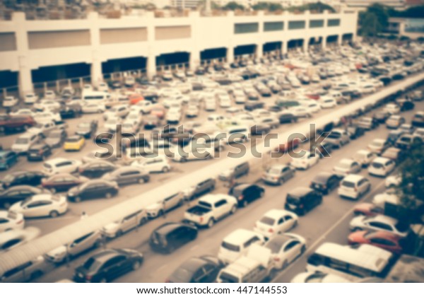 abstract blurry\
car in cars park, blur\
background