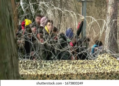 Abstract, blurry, out of focus image for media and internetа. A group of unorganized people are trying to illegally cross the border. - Shutterstock ID 1673803249