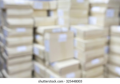 Abstract blurry warehouse storing a lot of stack of large box background