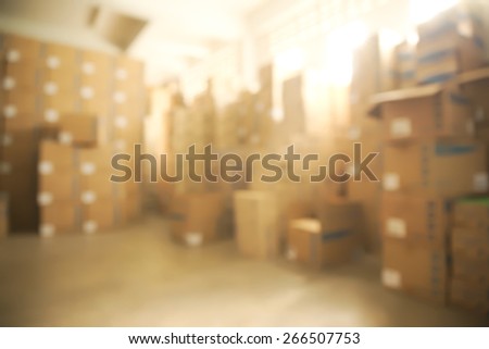Abstract blurry warehouse storing a lot of stack of large box background