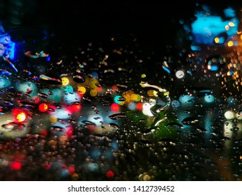 Abstract Blury Rain Drops On Car Windsheild , Abstract Blur City Night Traffic Light Bokeh In Stormy Season