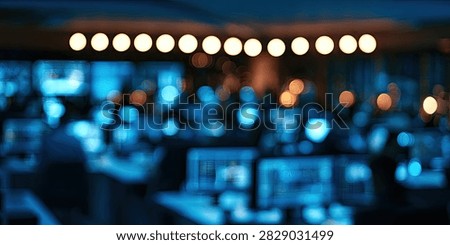 Abstract bokeh background with blurred office lights and a row of bright lights overhead.