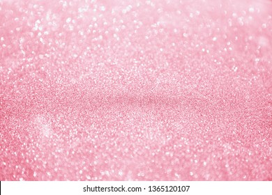 Abstract bokeh background. Christmas Glittering background. Abstract christmas coral color background. Glittering Christmas background. Coral color
