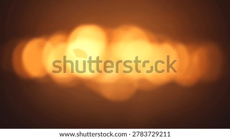 Abstract bokeh background featuring warm golden light and soft focus effect. Ideal for creating a dreamy and artistic visual experience.