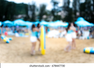 Abstract bokeh background of people on the beach
