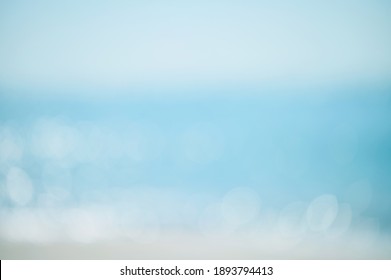 Abstract Bokeh Background From Summer Blue Sea Water At The Beach