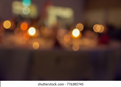 Abstract Bokeh Candle Light Dinner At A Restaurant.