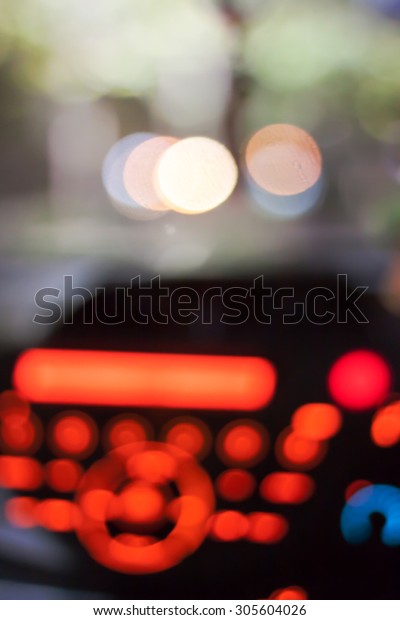 Abstract bokeh of car speed meter light dashboard with\
traffic light 