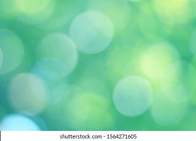 
Abstract bokeh, green and blurred background, naturally beautiful in the summer, in which sunlight is transmitted, resulting in a bluish green-blue bokeh as a yellow-blue light spot.