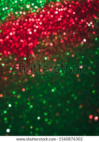 Abstract bokeh multi colors sparkles, Festive Christmas sparkling lights bokeh background,red and green.