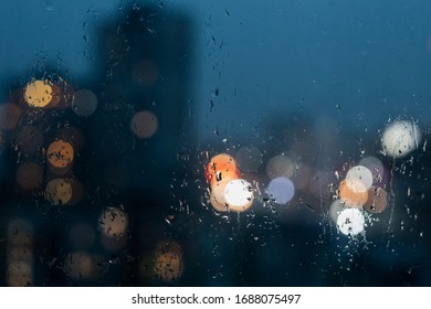 Abstract bokeh night  light in city background, night city through rain window, defocused background - Shutterstock ID 1688075497