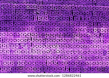 Abstract brick wall stack background with pruple filter