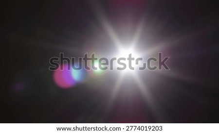 Abstract bright light flare effect on a dark background with lens flare. This image features a vibrant burst of light, perfect for various design projects.