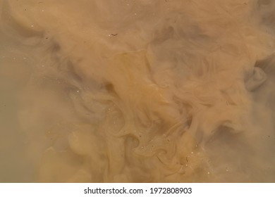 Abstract brown background, pattern. Muddy water, dirty river flow.