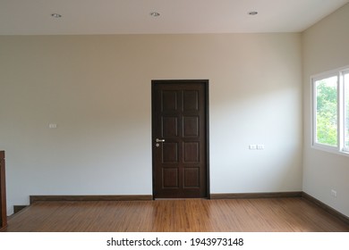 Abstract Brown Door Close In Dark Light. Sad And Alone Emotion In Empty House. Vacancy Property White Wall Background. 