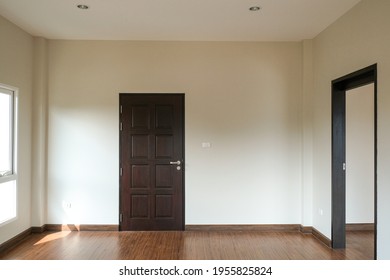 Abstract Brown Open And Close Door In Dark Light. Sad And Alone Emotion In Empty House. Vacancy Property White Wall Background. 