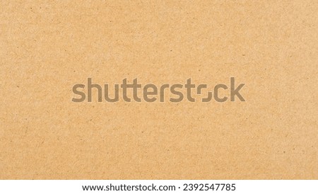 Abstract brown recycled paper background.
Old Kraft paper texture box craft stripes pattern.
top view.