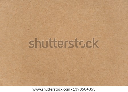 Abstract brown recycled paper texture background or backdrop. Empty old cardboard or recycling paperboard for design element. Simple beige grainy surface for journal template presentation.