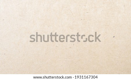 Abstract brown recycled paper texture background.
Old Kraft paper box craft pattern.
top view.