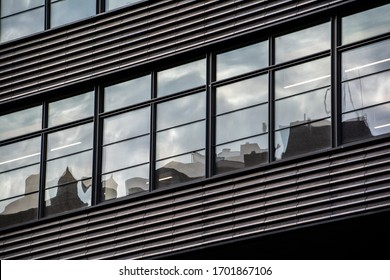 Abstract Buildings and Clouds Reflection on Window