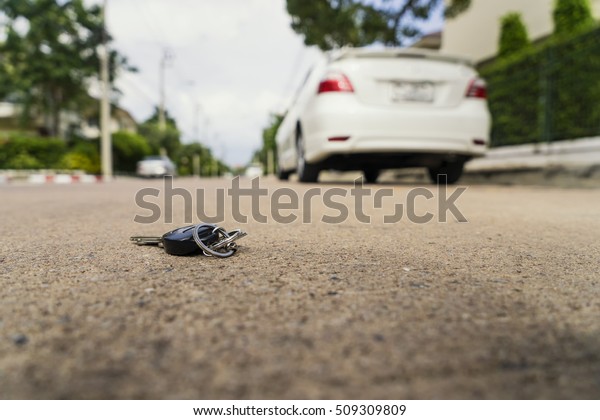 abstract car key fall on the cement ground -\
can use to display or montage on\
product
