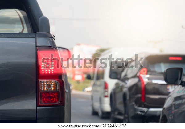 Abstract of car rear lights from\
brake. Cars parked close to each other during traffic\
jams.
