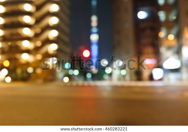 Abstract Car traffic at night. Motion\
blurred. Which urban city beautiful\
background.