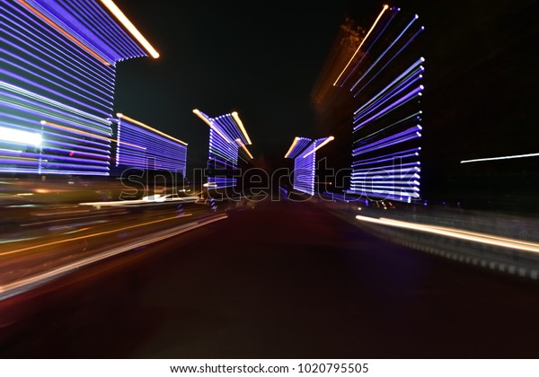 Abstract car trail on road. Abstract image of\
night traffic light on\
street