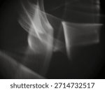 Abstract caustic light patterns created by refraction and reflection on a transparent surface. Can be used as overlay elements for design projects. 