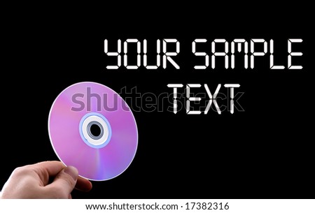 abstract cd dvd blue-ray disk in hand isolated on black