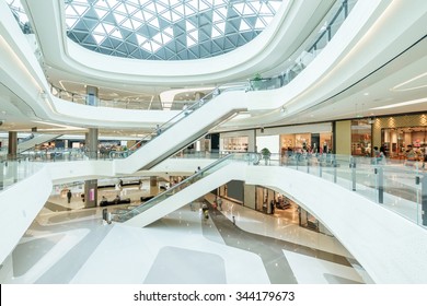abstract ceiling and escalator in hall of shopping mall