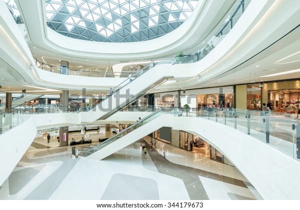 abstract\
ceiling and escalator in hall of shopping\
mall