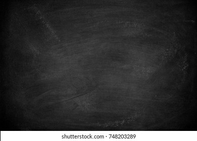 Abstract Chalk rubbed out on blackboard or chalkboard texture. clean school board for background or copy space for add text message.  - Shutterstock ID 748203289