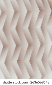 Abstract Chevron Pattern,3D Beige Geometric Texture,Close-up of an abstract, three-dimensional chevron pattern with a light beige tone. Geometric surface with a minimalist design, suitable